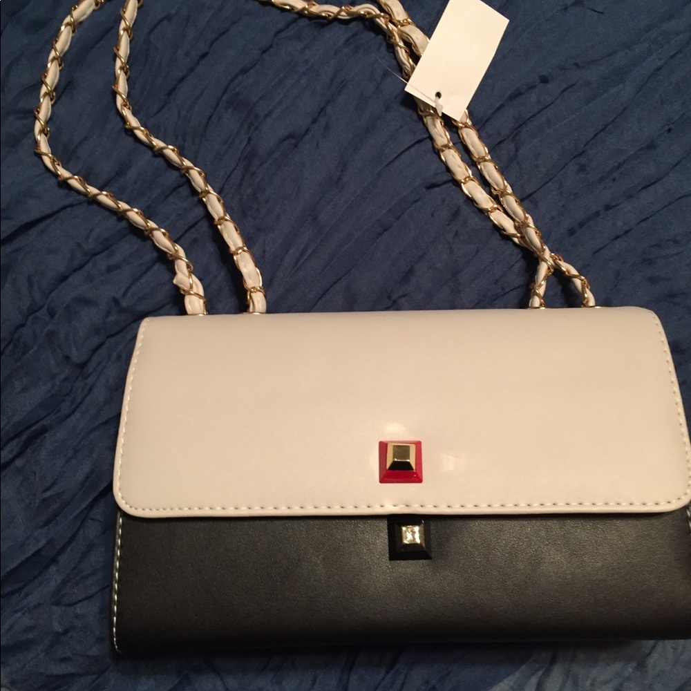 Flap over crossbody handbag, strap converts.